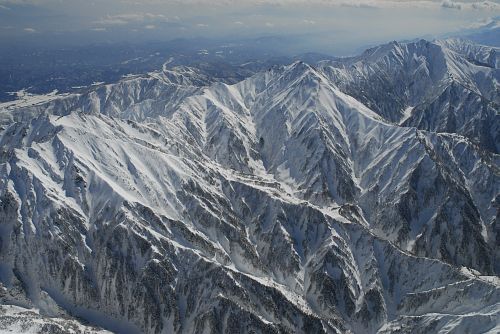 中背山上空より　左から唐松岳・五竜岳・鹿島槍ヶ岳2/20